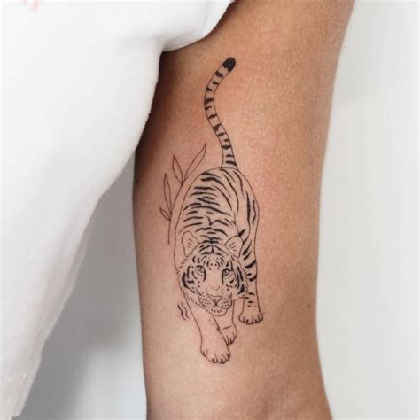 tiger forearm tattoo|fine line tiger tattoo.